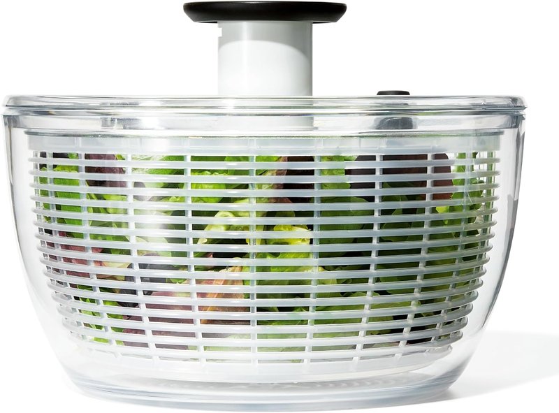Clear OXO salad spinner with a white basket