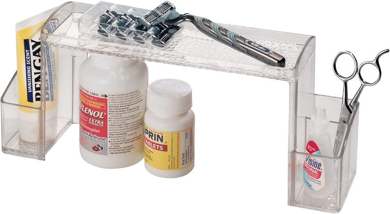 Clear iDesign shelf riser holding bottles and scissors