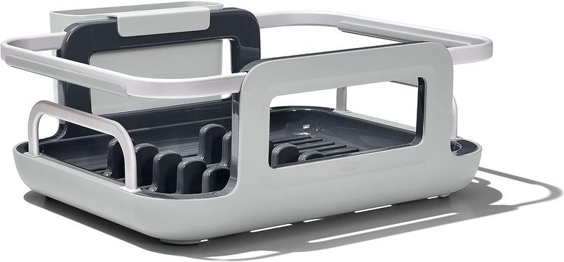 Grey and aluminum OXO dish rack that spans a sink